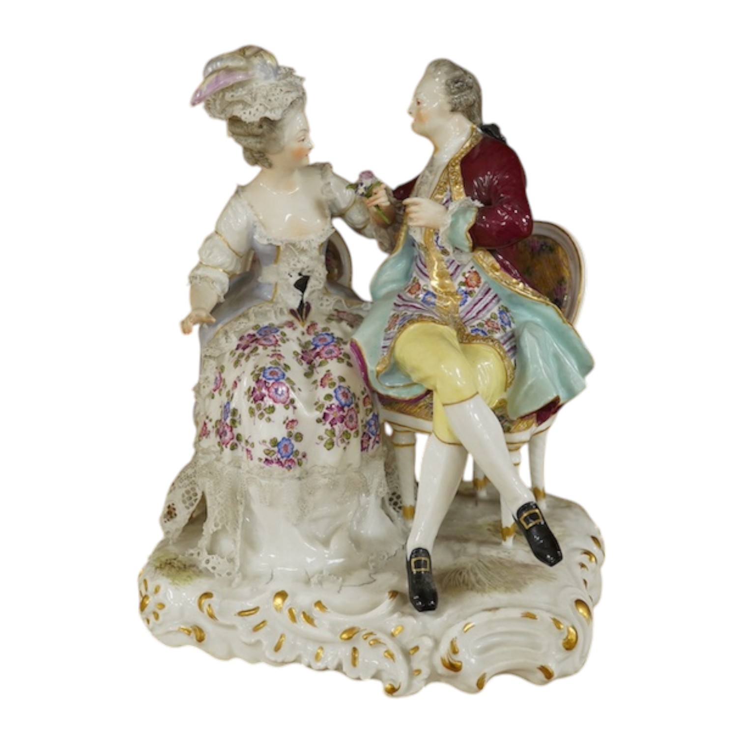 A Sitzendorf tete-a-tete porcelain figure group, signed to the base, 21cm high. Condition - fair, some losses and firing cracks